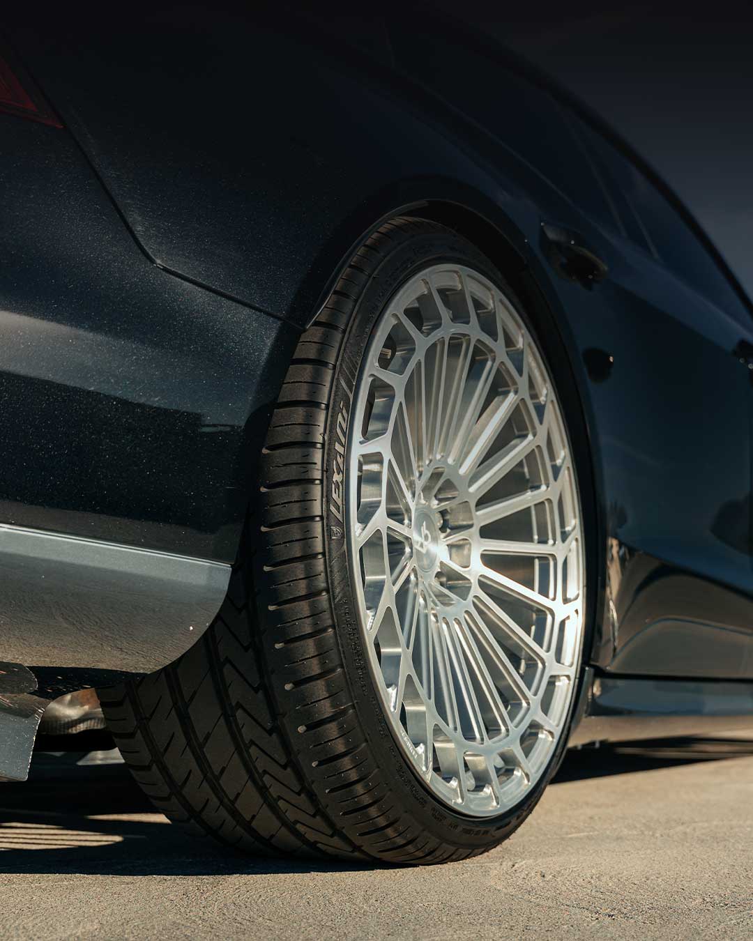 black audi e tron gt with luxury wheels and lexani lx twenty tires