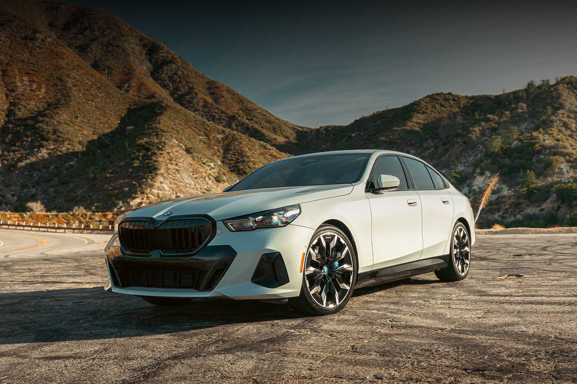 lexani volt ec ev tire on gray bmw i5 on mountain highway