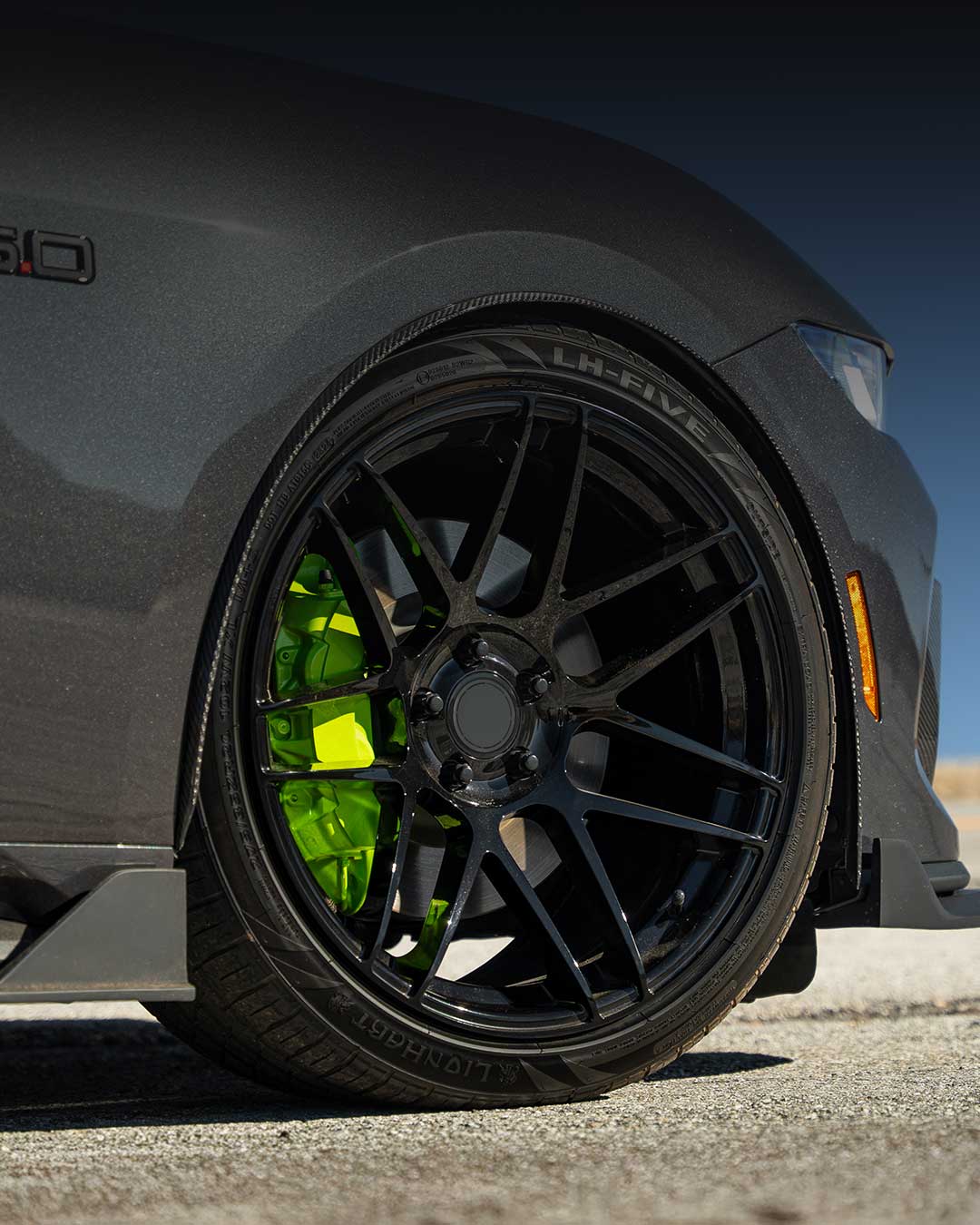 gray ford mustang gt with performance wheels and lionhart lh five tires