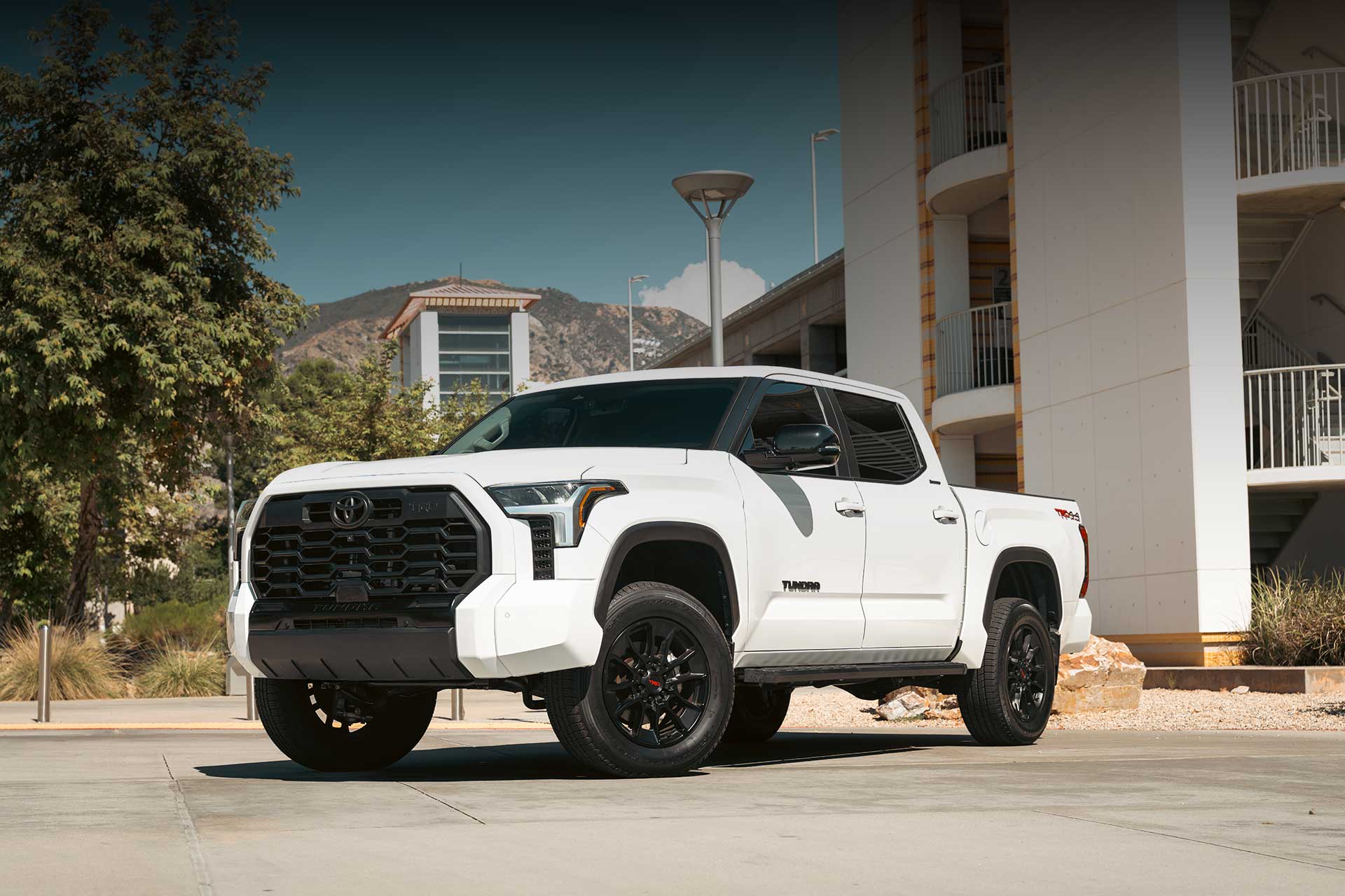 white toyota tundra trd off road with rbp guarantor highway terrain tires
